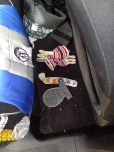 Dirt. And more dirt. Baby carrier, gloves, the never ending stickers from Trader Joes, and an elusive belly pad. They don't belong there yet gravity must be strong because they all migrate there anyway.