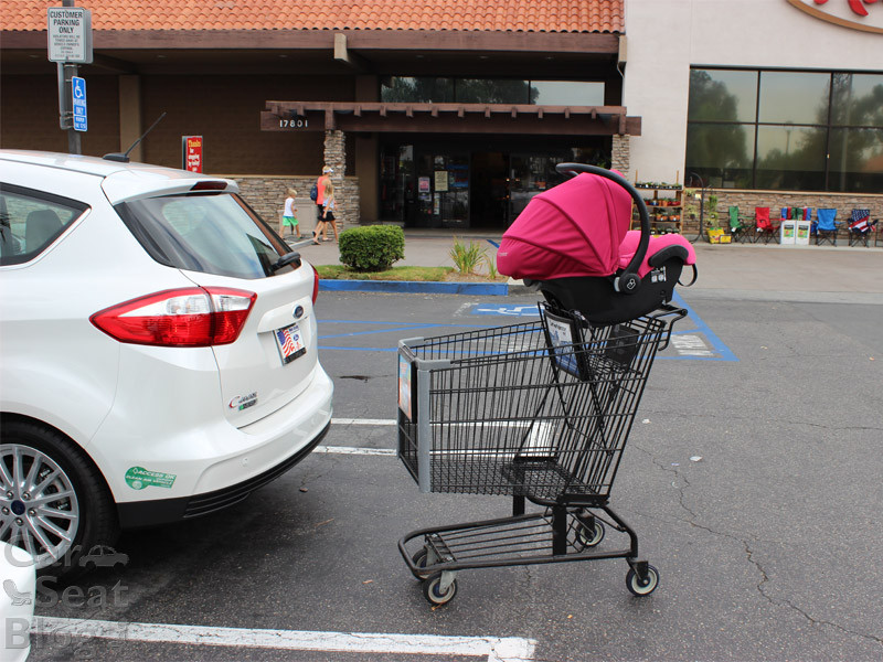 car seat on top of shopping cart